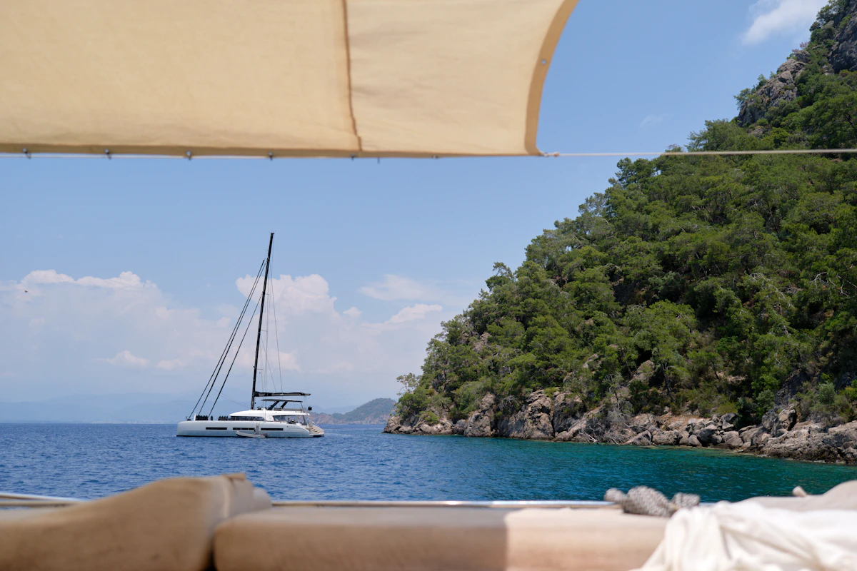 Sailing yacht anchored off a Mediterranean coast